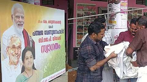 ബിജെപി സ്ഥാപിച്ച ഫ്ളക്സ് ബോര്ഡ്, കോണ്ഗ്രസ് പ്രവര്ത്തകര് ബോര്ഡ് വലിച്ചു കീറുന്നു