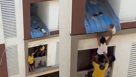 മേല്ക്കൂരയില് തങ്ങി പിഞ്ചുകുഞ്ഞ്, അതിസാഹസികമായി രക്ഷപ്പെടുത്തല്; ശ്വാസം അടക്കിപ്പിടിച്ച് കാഴ്ചക്കാര്-വീഡിയോ