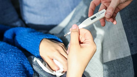 woman Hand Holding Thermometer