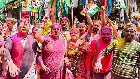 Congress workers celebrate after party's victory in Uttarakhand Assembly by-elections