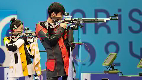 China wins first gold medal