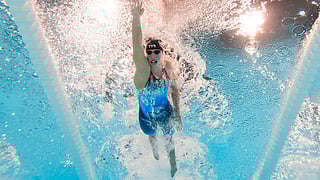 Katie Ledecky swims into history