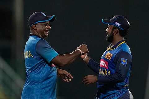 Sri Lanka's captain Charith Asalanka and coach Sanath Jayasuriya celebrate their win over India
