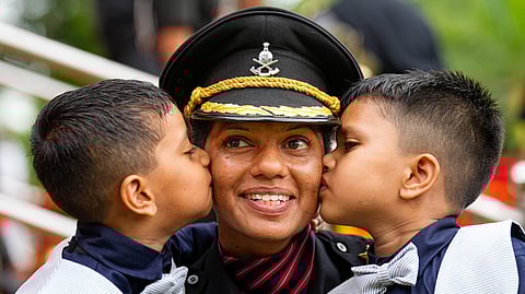 Cadet Usha Rani with her twins after the 'Passing out Parade' at Officers Training Academy (OTA), in Chennai