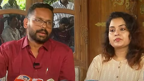 P Sarin and his wife meet the media