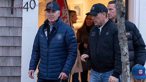 President Joe Biden and son Hunter Biden walk in downtown Nantucket Mass