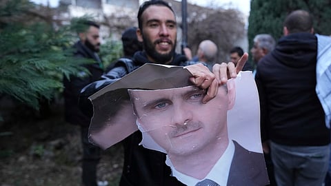 Russian state news agencies say ousted Syrian leader Assad is in Moscow, given asylum
