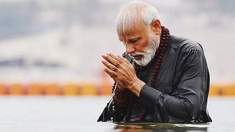 PM to take holy dip at Kumbh tomorrow as Delhi goes to polls