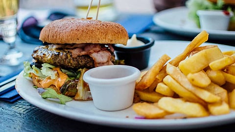 image of burger and french fries served on a plate