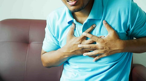 man feeling chest pain heart diseases in kerala