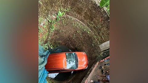 Car falls into well