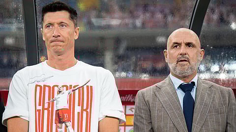 Michal Probierz and Robert Lewandowski at football match