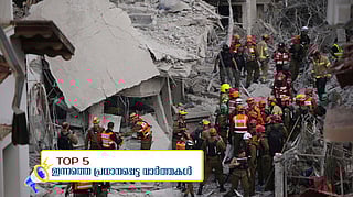 Israeli security forces inspect destroyed houses that were struck by a missile fired from Iran