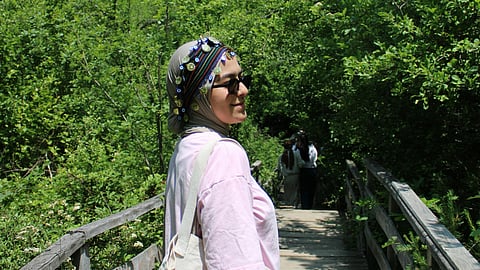 woman standing on a bridge