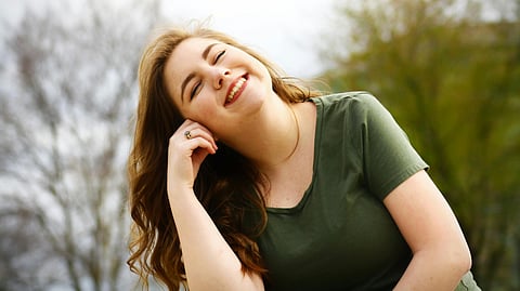 Woman in Green Shirt Smiling