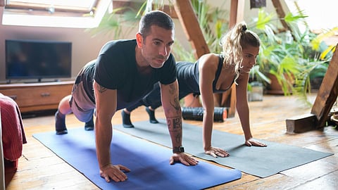 Man and Woman Doing Push Up Together