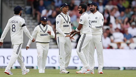 Jasprit Bumrah celebrates his wicket with his teammates