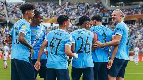 Manchester City players celebrate a goal