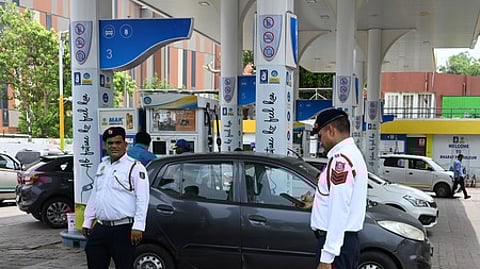 Traffic Police personnel keep a vigil at a petrol pump after fuel ban for end-of-life  vehicles under the directions of Commission for Air Qua