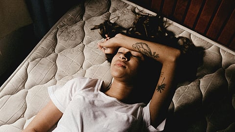 Woman sleeping in a bed