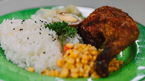rice and chicken served in a plate