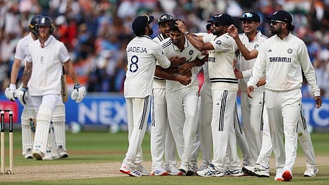 Washington Sundar is congratulated by his teammates for dismissing Ben Stokes