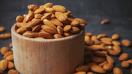 almonds in a wooden bowl