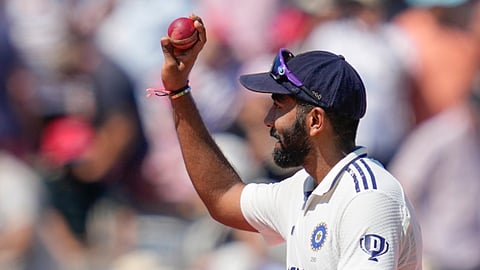 India's Jasprit Bumrah holds up the ball in celebration after taking a five-wicket haul