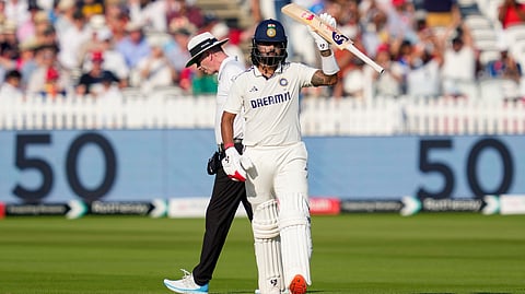 India's batter KL Rahul celebrates his half century