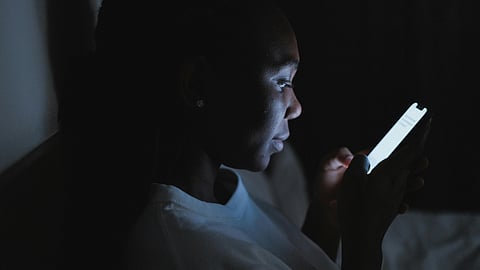 wOMAN USING MOBILE IN NIGHT