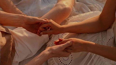 couple holding hand together