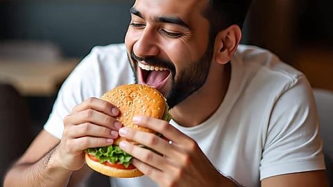 Man eating burger