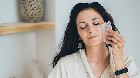 woman face oil massage