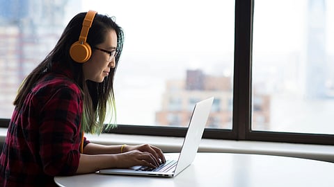 woman wearing headset during work
