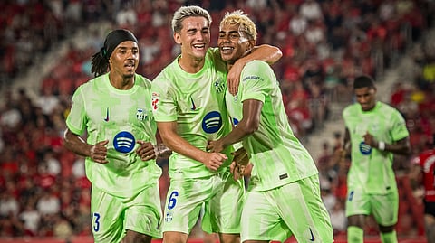 Lamine Yamal celebrates scoring a goal with his teammates