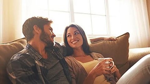 Happy couple sitting in a couch
