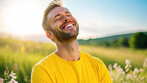 Man in a field happy emotion