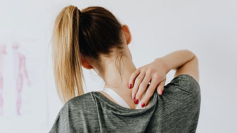 Woman having neck pain