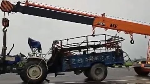 The mangled remains of the truck being taken from the accident site