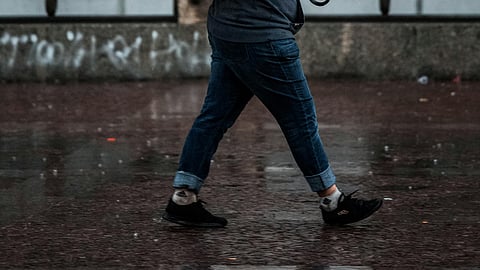 woman walking through rain