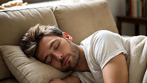 MAN SLEEPING ON A SOFA