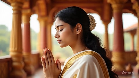 Young woman prays in temple