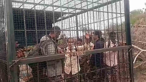 forest staff were allegedly held captive by villagers in a cage Chamarajanagar Karnataka