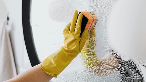 woman Cleaning mirror