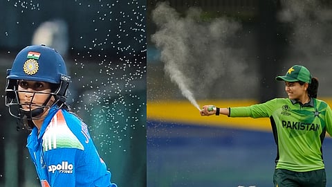Pakistan's captain Fatima Sana sprays insect repellent to ward off bugs flying over the pitch