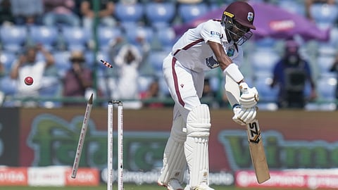 West Indies' Khary Pierre being bowled by India's Jasprit Bumrah