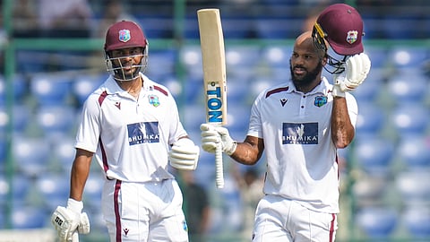 West Indies' John Campbell cellebrates his century as Shai Hope looks on during the forth day of the second and final Test cricket match between India and West Indies