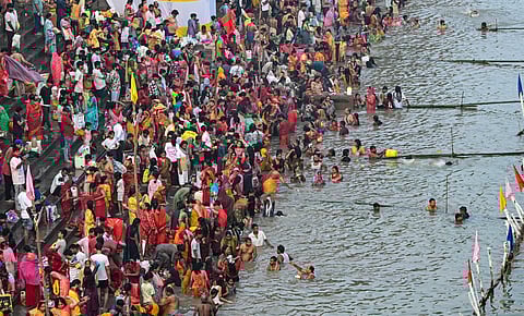 people take a holy dip in the Ganga River on the first day of the four-day-long 'Chhath Puja