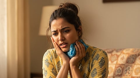 Woman having tooth pain