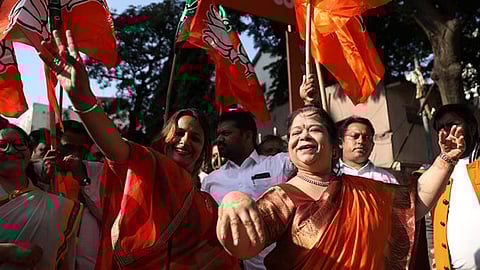 BJP party members celebrate the NDA's victory in the Bihar Elections at Patna